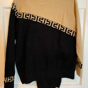 Stylish Black and Tan Sweater with matching pants.